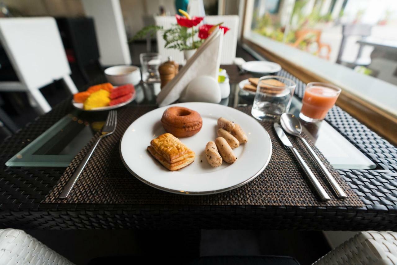 โรงแรมเดอะ พาโนรามิก เกตะเวย์ มุนนาร์ ภายนอก รูปภาพ A breakfast table at a hotel